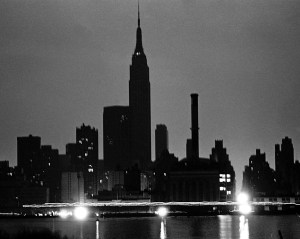 The NYC skyline from Queens during the power blackout of 1977. Lights glow in a midtown Waterside Con Ed plant as traffic passes on East Side Drive. Photo: Dan Farrell/NY Daily News via Getty Images.