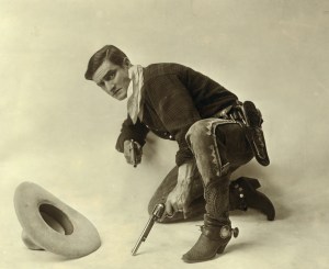 Hollywood's romanticized version of the American cowboy in blue jeans began in silent films with Tom Mix, here seen hamming it up during a photo shoot, circa 1919. Photo courtesy Library of Congress.